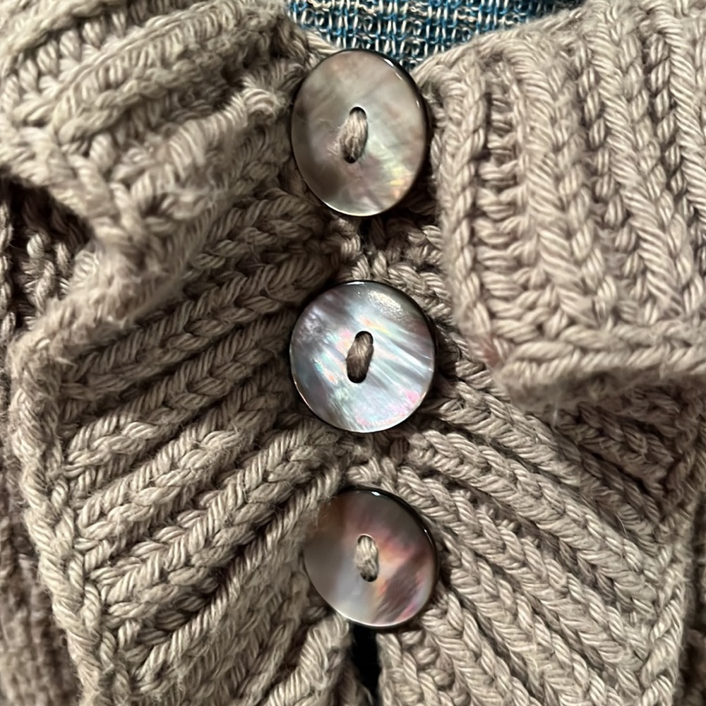 Hand knit cardigan with abalone buttons by Pure Collection.